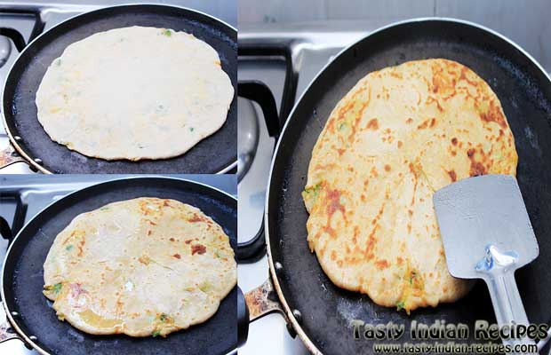 Place paratha on hot tawa. Drizzle oil and cook it on medium flame Place paratha on hot tawa. Drizzle oil and cook it on medium flame