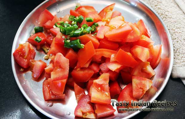 Chop tomatoes and green chilies Chop tomatoes and green chilies
