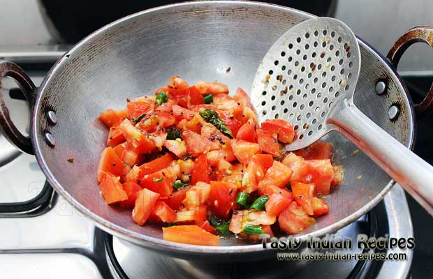 Add chopped tomatoes along with green chilies and cook continue for 2 minutes Add chopped tomatoes along with green chilies and cook continue for 2 minutes