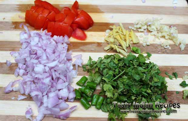 Chop onion, tomato, ginger, garlic, green chillies and coriander leaves finely. Also make some ginger julienne Chop onion, tomato, ginger, garlic, green chillies and coriander leaves finely. Also make some ginger julienne