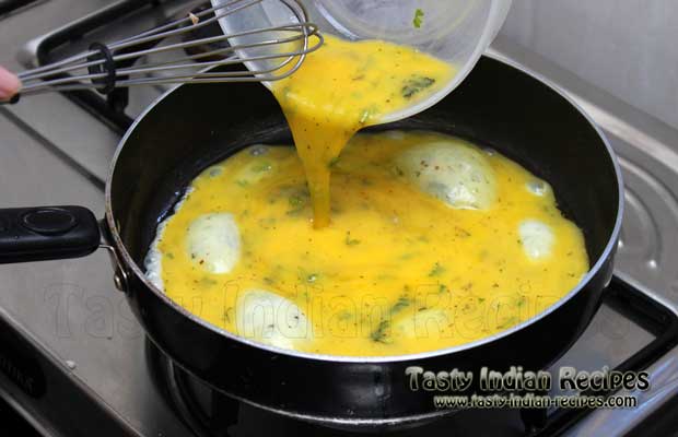 Pour the egg mixture into the pan and spread evenly Pour the egg mixture into the pan and spread evenly