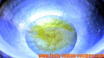 Heating oil in a vessel for making ragda