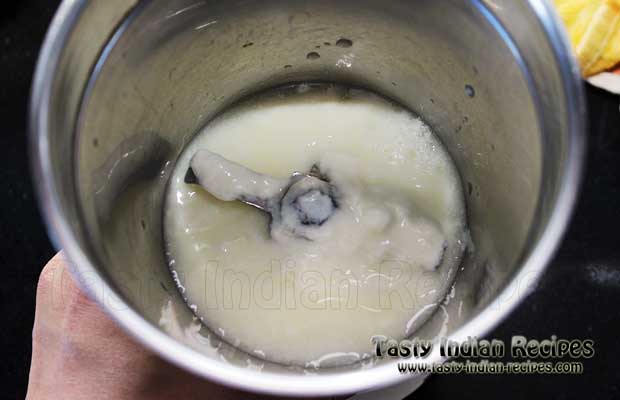 Pour curd in a Chaas making jar Pour curd in a Chaas making jar