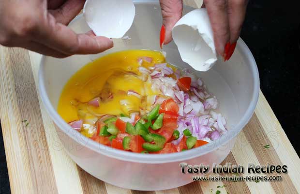 Beat Eggs in the mixture of onion, tomatoes, capsicum and green chilies Beat Eggs in the mixture of onion, tomatoes, capsicum and green chilies