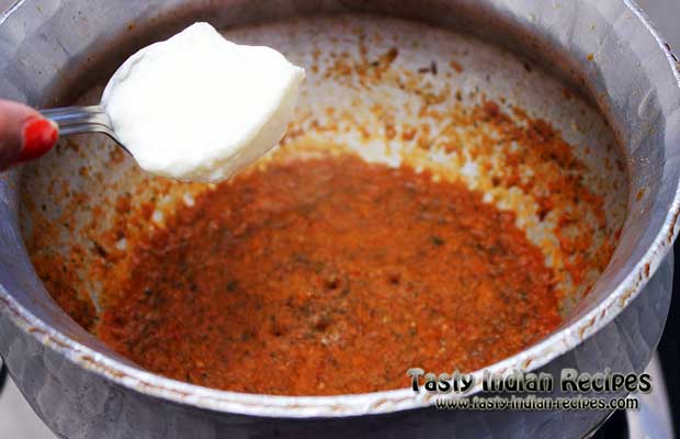 When the gravy turns little red in color then add curd into it and mix well When the gravy turns little red in color then add curd into it and mix well