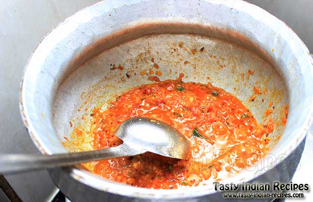 add crushed coriander seeds, hing, red chillies and garam masala powder. Pour this into dal and combine.