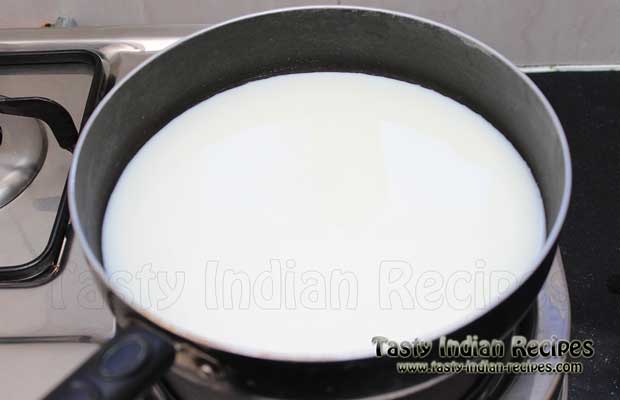 Heat milk in a non-stick pan over medium high flame Heat milk in a non-stick pan over medium high flame